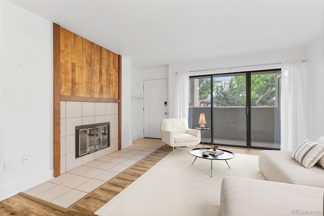20 S Boulder Cir Unit 2109, Boulder, CO 80303 - living room featuring a tile fireplace and wood finished floors