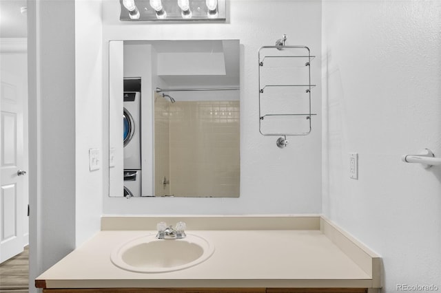 20 S Boulder Cir Unit 2109, Boulder, CO 80303 - bathroom with stacked washer / dryer and vanity