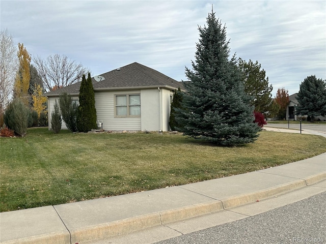 view of home's exterior featuring a lawn