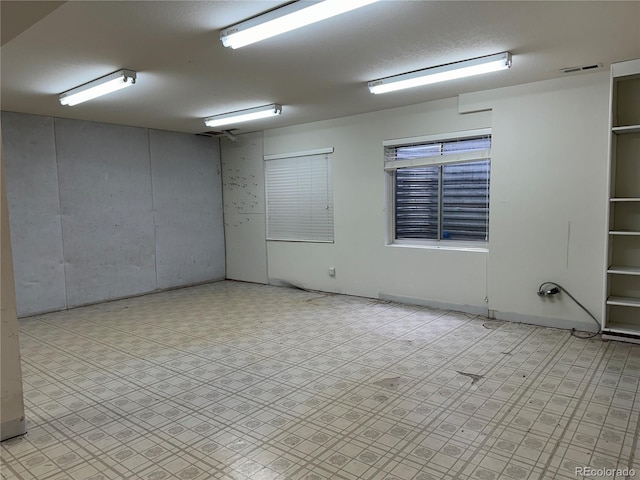 spare room featuring a textured ceiling