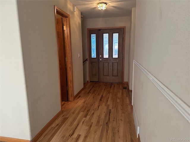 doorway to outside featuring light hardwood / wood-style floors