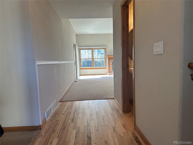 hall with light wood-type flooring