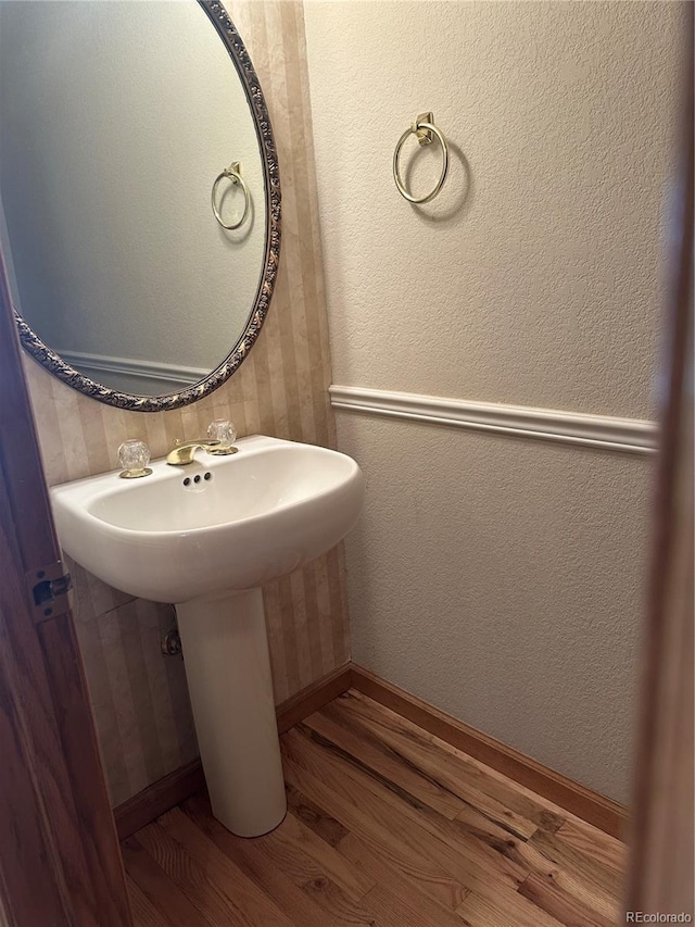 bathroom with hardwood / wood-style floors