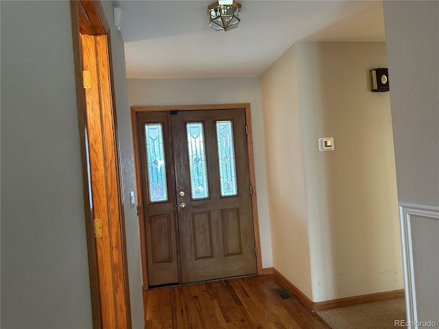 foyer entrance with hardwood / wood-style flooring