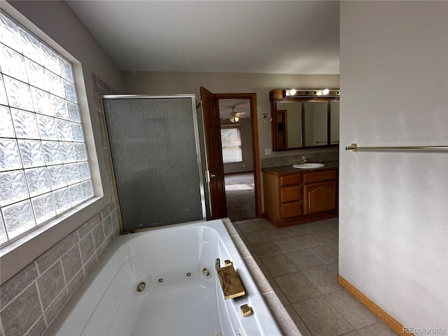 bathroom featuring vanity, separate shower and tub, and tile patterned floors