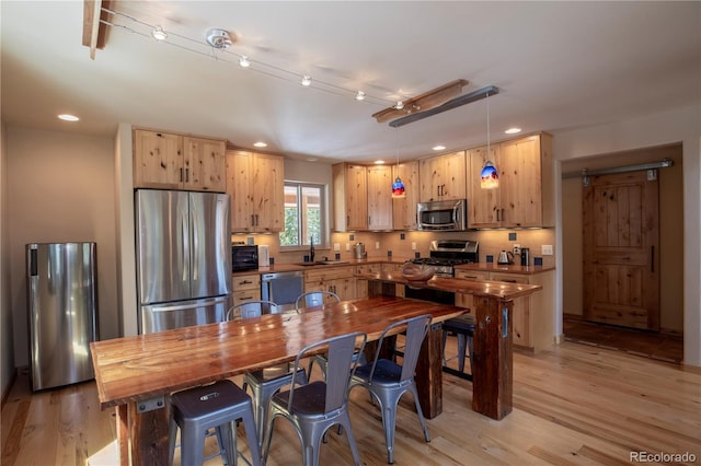 344 Puma Pl, Fairplay, CO 80440 - kitchen featuring stainless steel appliances, recessed lighting, light wood-style floors, decorative light fixtures, and a ceiling fan