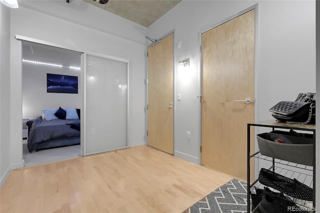 2229 Blake St Unit 505, Denver, CO 80205 - bedroom with wood finished floors