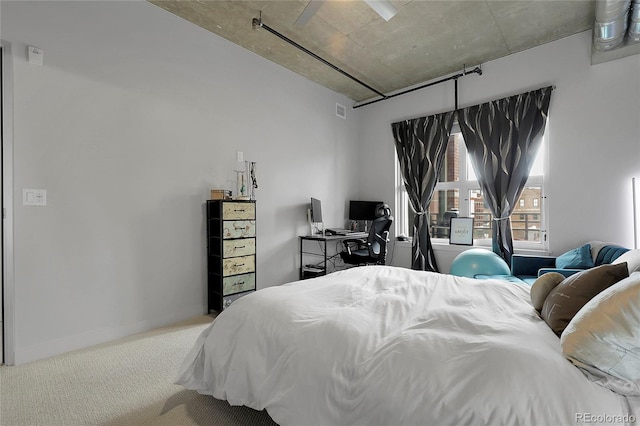 2229 Blake St Unit 505, Denver, CO 80205 - bedroom with carpet floors, a desk, and baseboards