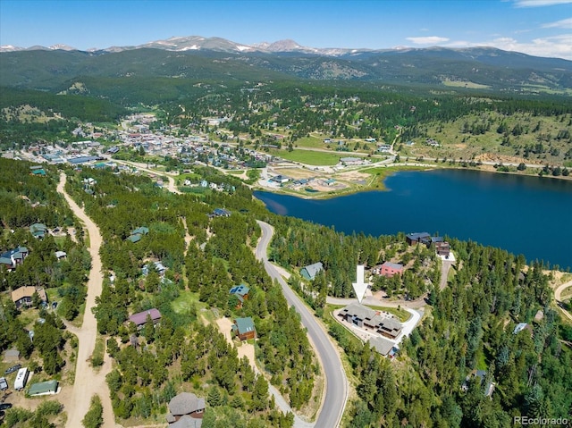 drone / aerial view with a water and mountain view