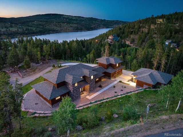 aerial view at dusk with a water view