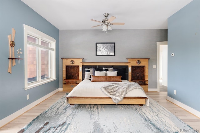 bedroom featuring ceiling fan and light hardwood / wood-style floors