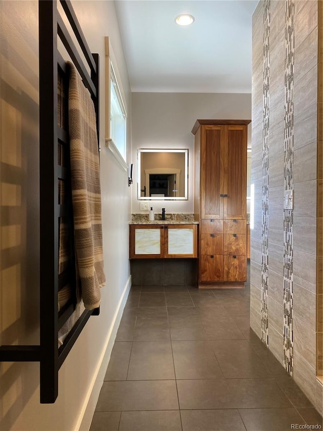 corridor featuring dark tile patterned flooring