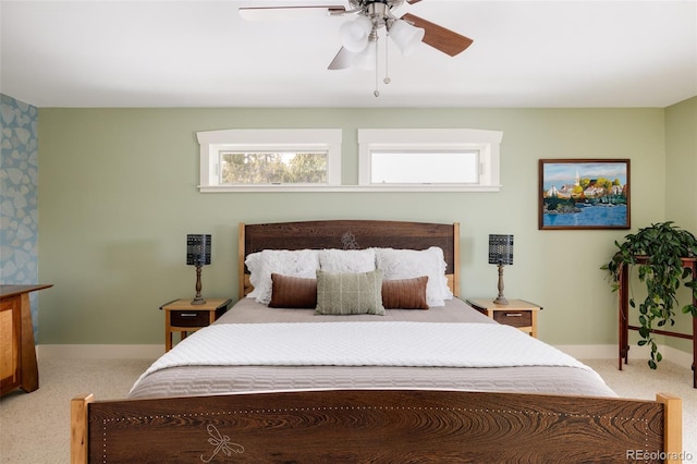 bedroom featuring ceiling fan and carpet