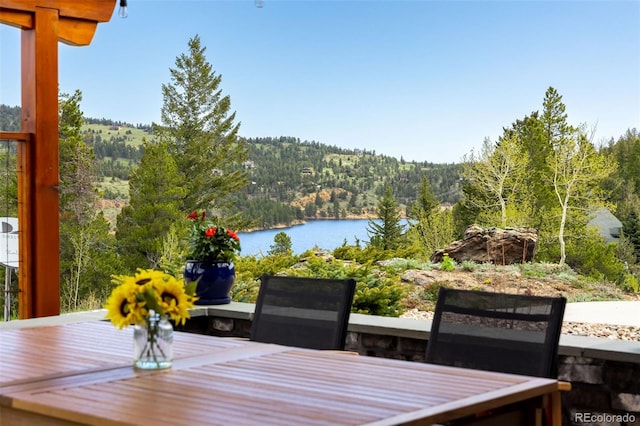 wooden deck featuring a water view