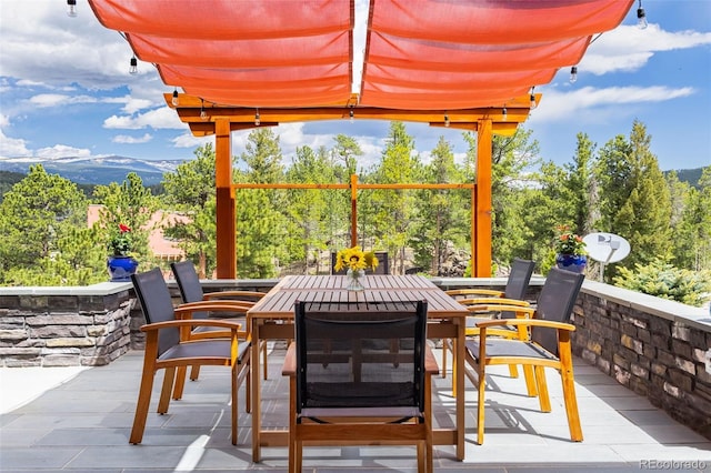 view of patio / terrace with a mountain view