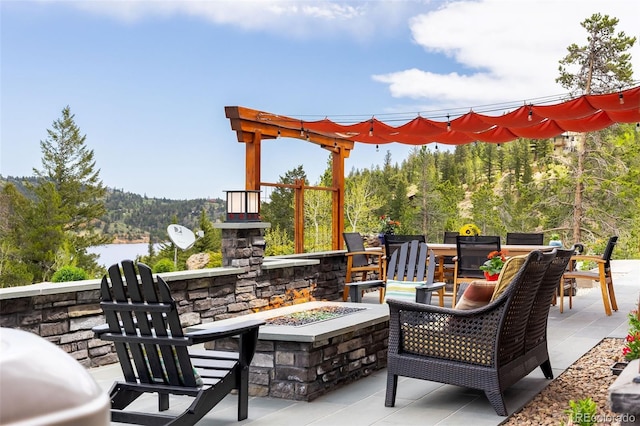 view of patio with a fire pit