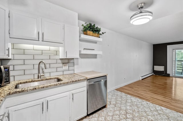 705 S Alton Way Unit 6B, Denver, CO 80247 - kitchen with stainless steel appliances, open shelves, white cabinetry, a baseboard radiator, and light stone counters