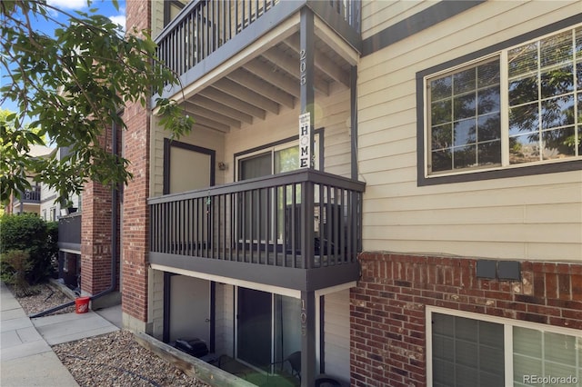 10784 W 63rd Pl Unit 205, Arvada, CO 80004 - view of home's exterior with a balcony and brick siding