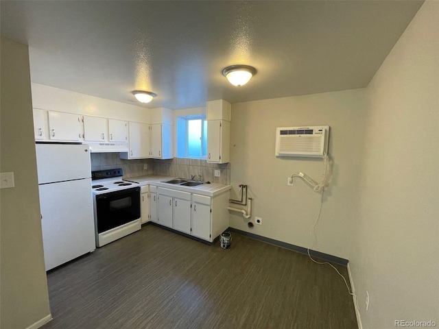 kitchen with white cabinets, white appliances, a wall unit AC, and dark wood-type flooring