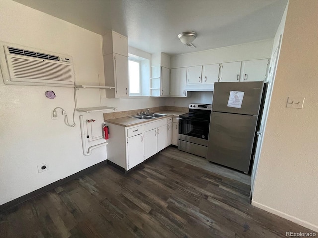 kitchen with white cabinets, sink, appliances with stainless steel finishes, and a wall mounted AC