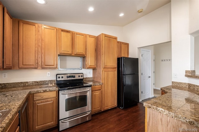 kitchen with dark hardwood / wood-style flooring, black fridge, vaulted ceiling, electric stove, and dark stone countertops