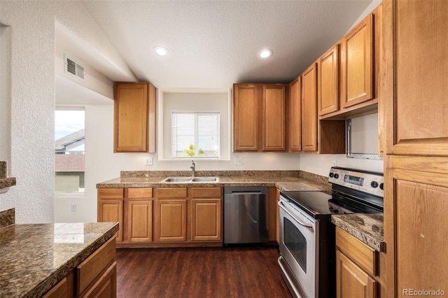 kitchen with dark hardwood / wood-style flooring, sink, and appliances with stainless steel finishes