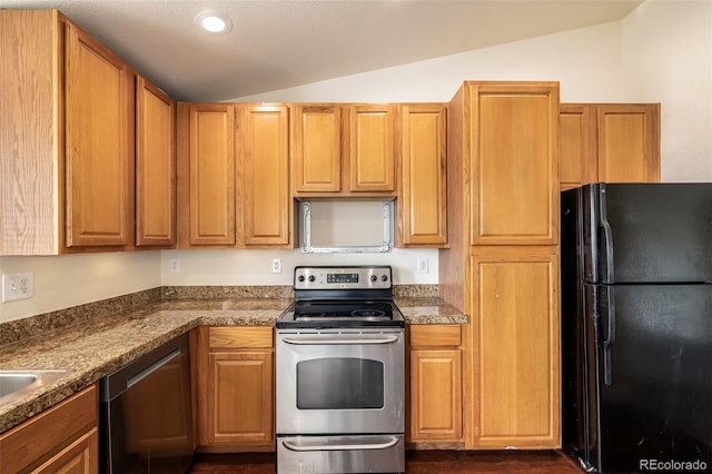 kitchen featuring vaulted ceiling and appliances with stainless steel finishes