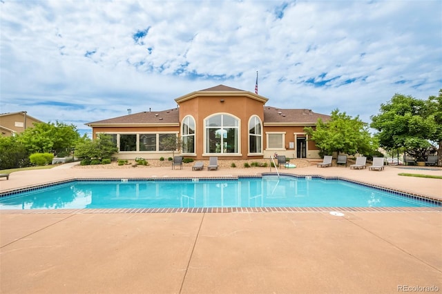 view of pool featuring a patio