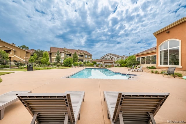 view of pool featuring a patio area