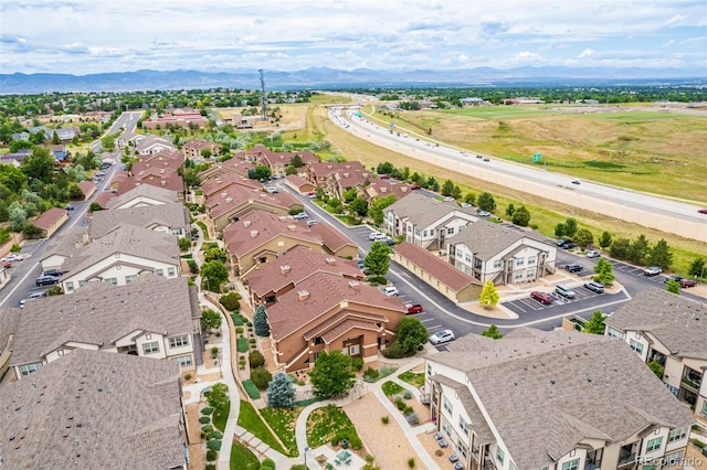 birds eye view of property featuring a mountain view