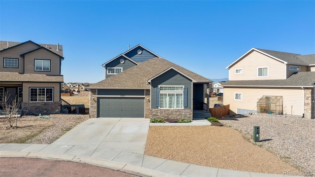 13135 Devils Thumb Pl, Peyton, CO 80831 - view of front of property with stone siding, an attached garage, driveway, and roof with shingles