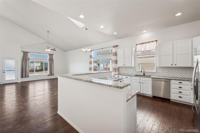 13135 Devils Thumb Pl, Peyton, CO 80831 - kitchen with dishwasher, a sink, a chandelier, backsplash, and dark wood-style floors