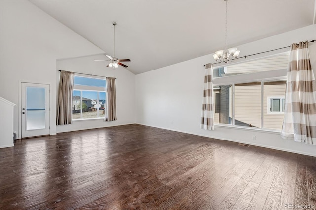 13135 Devils Thumb Pl, Peyton, CO 80831 - unfurnished living room with dark wood-style flooring, a ceiling fan, a chandelier, high vaulted ceiling, and baseboards
