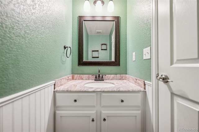 13135 Devils Thumb Pl, Peyton, CO 80831 - bathroom with a textured wall and vanity