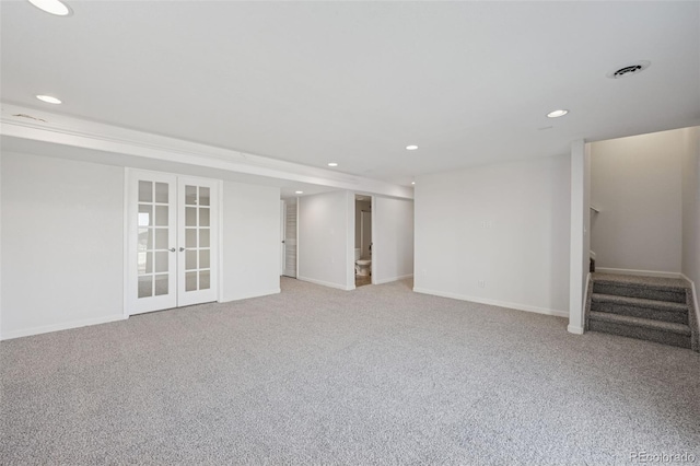 13135 Devils Thumb Pl, Peyton, CO 80831 - below grade area featuring stairs, recessed lighting, french doors, light colored carpet, and baseboards