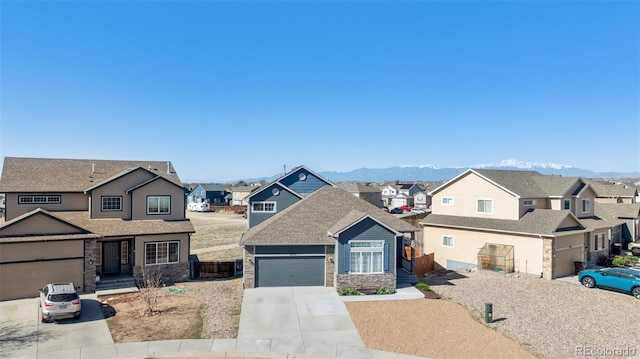 13135 Devils Thumb Pl, Peyton, CO 80831 - view of front facade featuring a residential view, driveway, stone siding, and an attached garage
