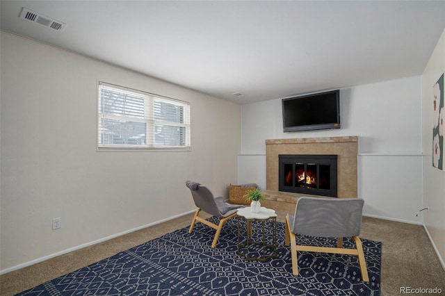 sitting room featuring carpet flooring