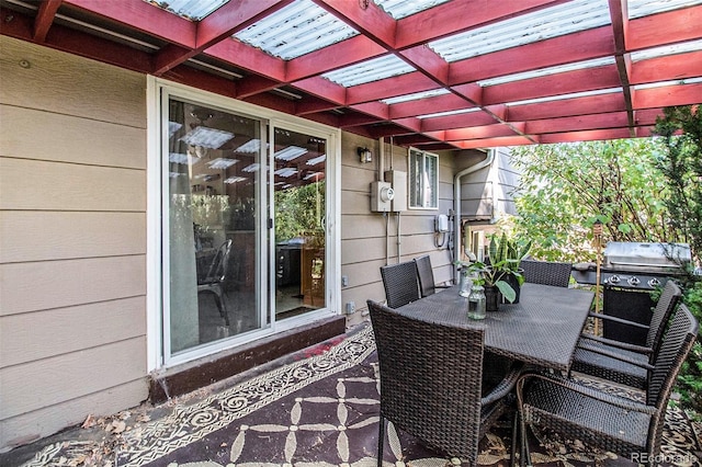 view of patio featuring a grill and a pergola