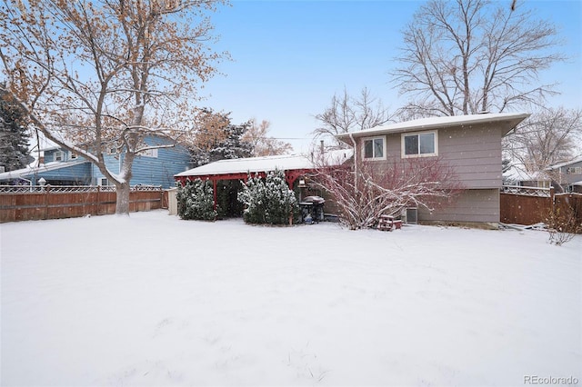 view of snow covered house