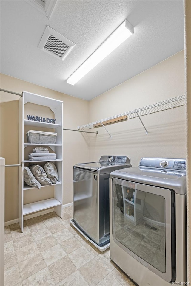 9530 Gray St, Westminster, CO 80031 - washroom featuring separate washer and dryer and baseboards
