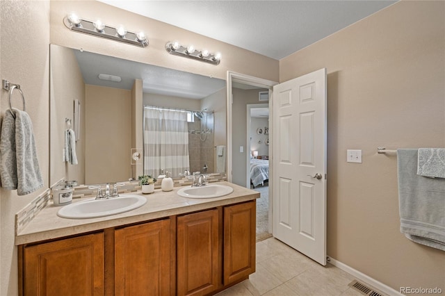 9530 Gray St, Westminster, CO 80031 - ensuite bathroom featuring tile patterned floors, double vanity, and a shower with shower curtain