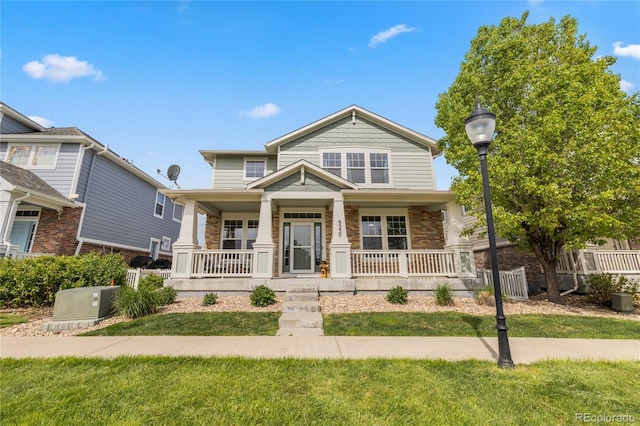 9530 Gray St, Westminster, CO 80031 - view of front of home featuring covered porch and brick siding