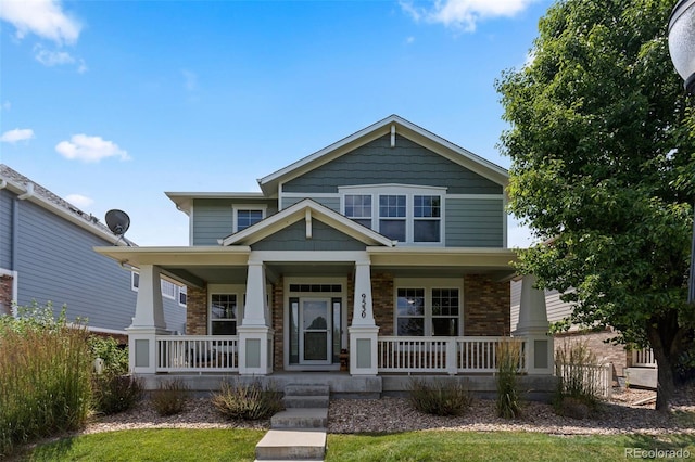 9530 Gray St, Westminster, CO 80031 - craftsman-style home with covered porch and brick siding