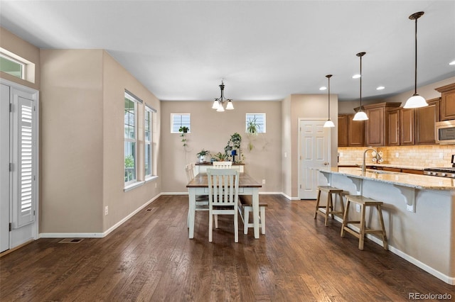 9530 Gray St, Westminster, CO 80031 - dining space featuring dark wood finished floors, a chandelier, and recessed lighting