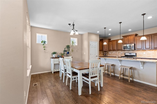 9530 Gray St, Westminster, CO 80031 - dining space featuring dark wood-style floors and recessed lighting