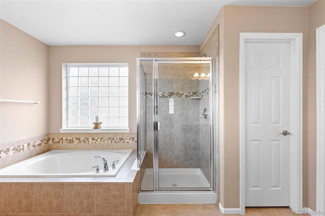 9530 Gray St, Westminster, CO 80031 - full bathroom featuring a bath, a stall shower, and tile patterned floors