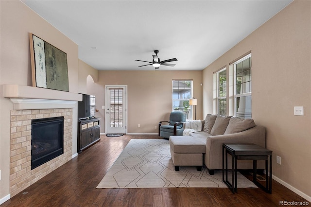 9530 Gray St, Westminster, CO 80031 - living area featuring wood finished floors, plenty of natural light, ceiling fan, and a fireplace