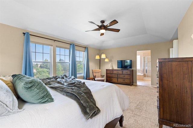 9530 Gray St, Westminster, CO 80031 - carpeted bedroom featuring a tray ceiling, connected bathroom, and ceiling fan