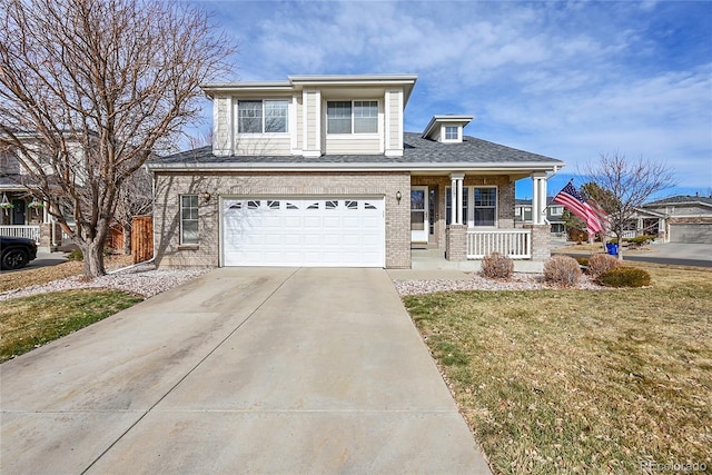 view of front of property featuring a porch, a garage, and a front yard