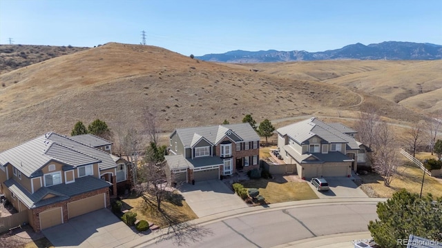 drone / aerial view with a residential view and a mountain view